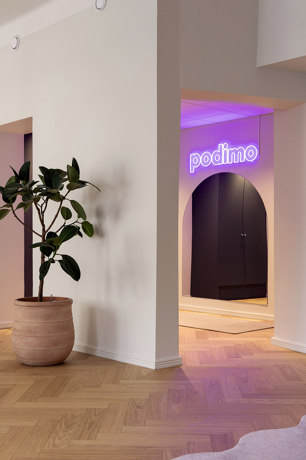 Podimo studio & office design lounge entrance neon sign