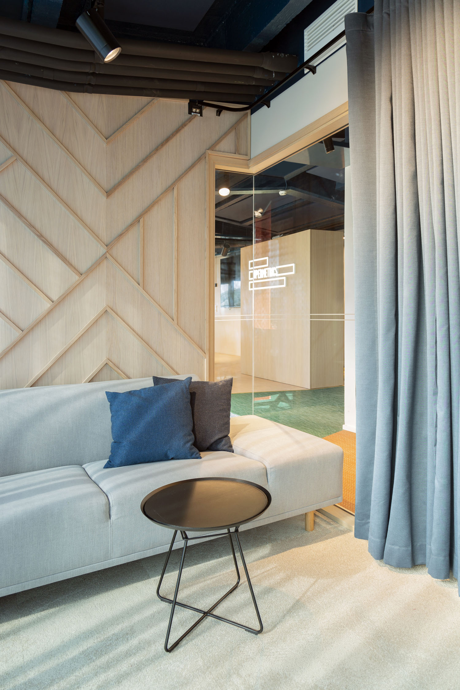 Supermetrics office meeting room swing custom wood panel