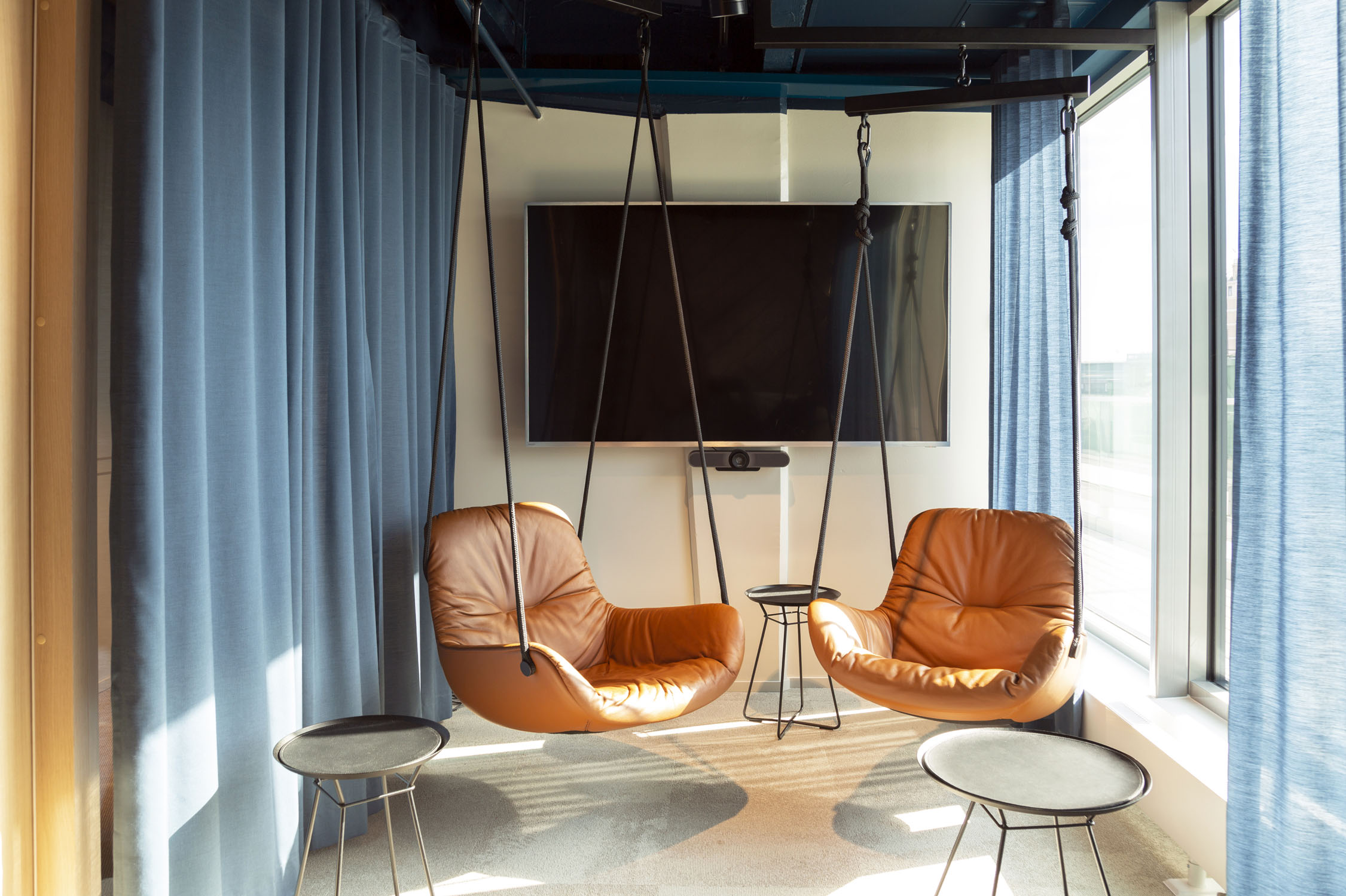 Supermetrics office meeting room swing chairs