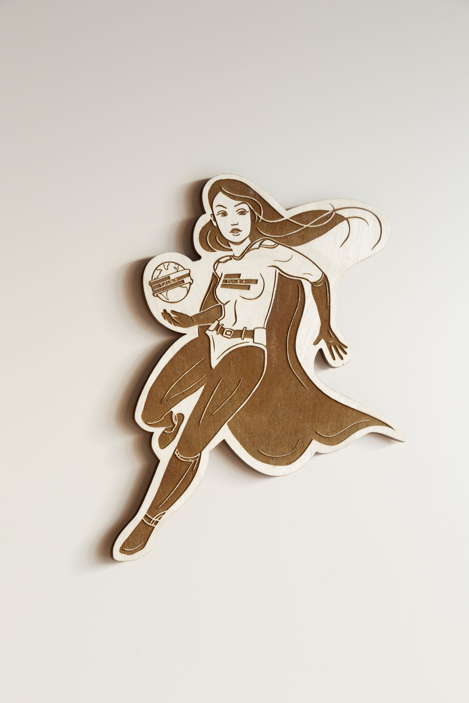 Supermetrics office rooftop sauna custom lasercut wood sign superhero