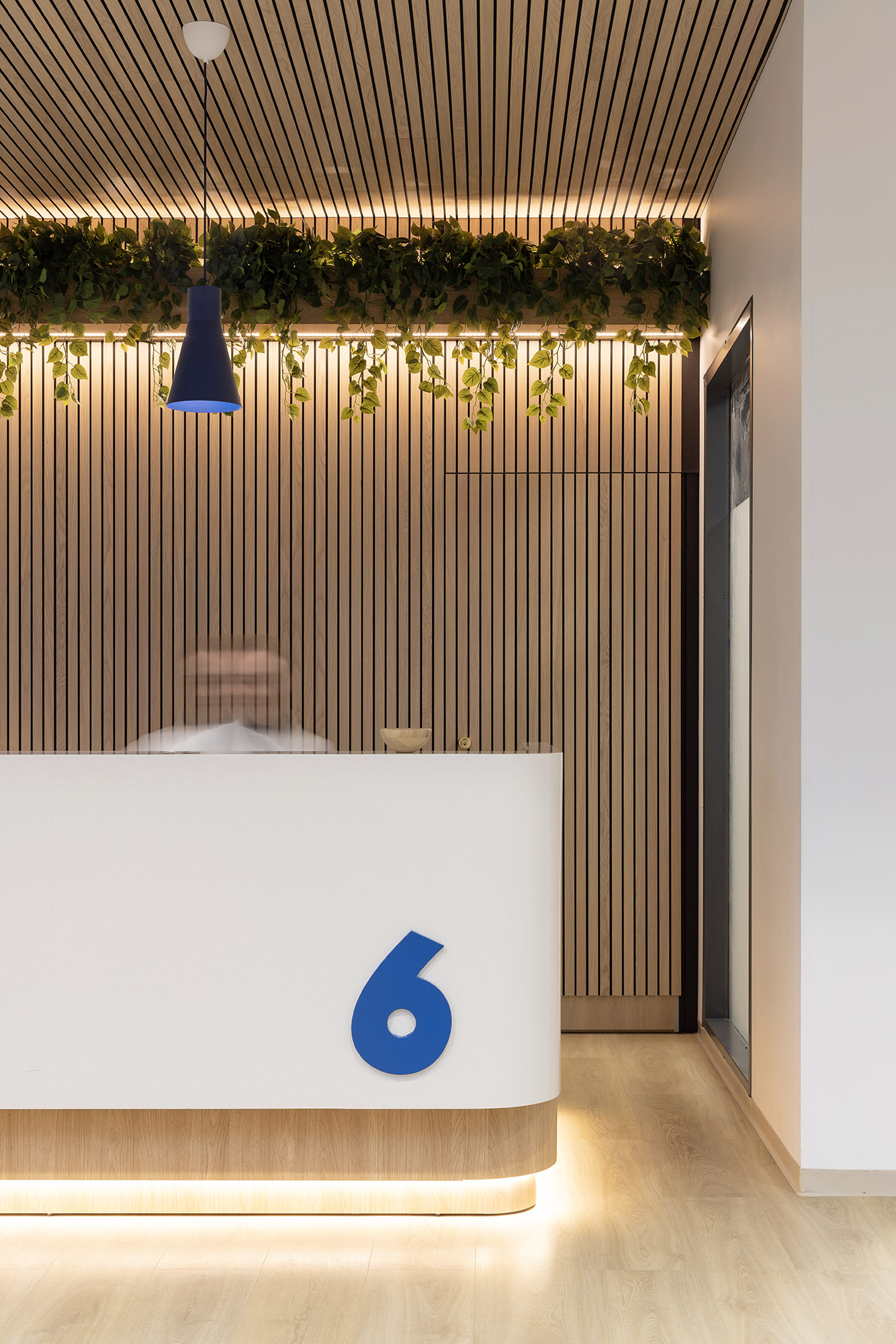 Terveystalo Kamppi hospital design lobby waiting area customer service counter detail